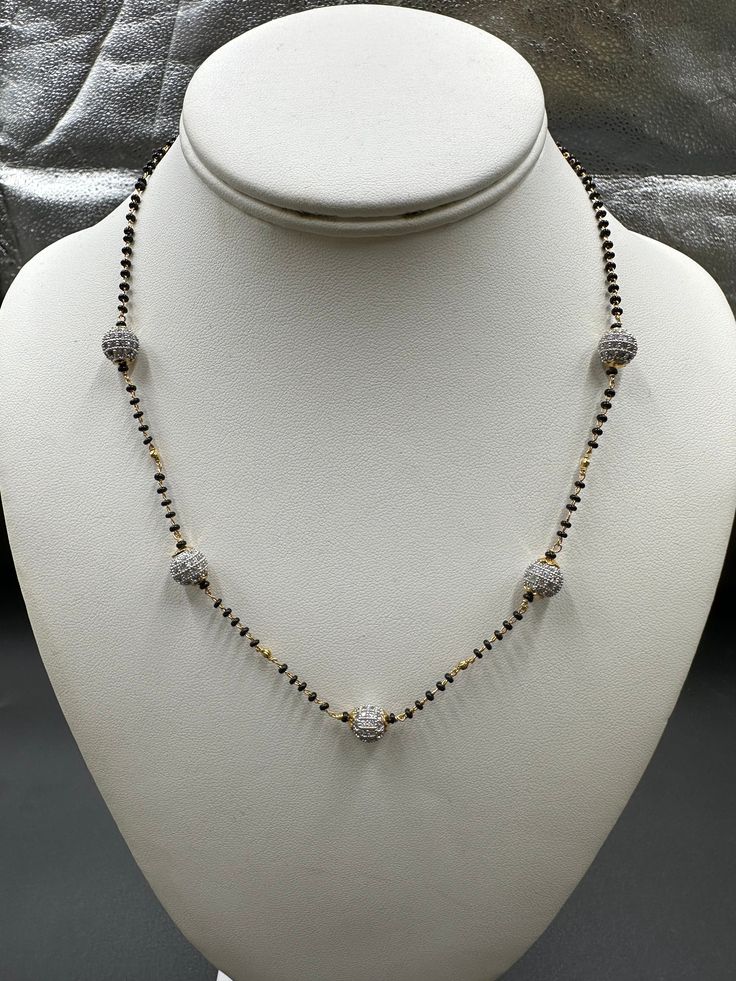 Single-line black diamond bead chain with CZ stone balls Handmade Jewelry  Silver-plated jewelry One gram of gold jewelry  For more products please visit  Globusfashions.com Official Website globusfashions.com 🌸 S H O P . M O R E . S T Y L E S  🌸 https://www.etsy.com/shop/Globusfashions Necklaces -  https://www.etsy.com/shop/Globusfashions?section_id=18712263 Bracelets - https://www.etsy.com/shop/Globusfashions?section_id=18969767 Pendant Sets - https://www.etsy.com/shop/Globusfashions?section Gold Necklaces With Black Beads For Party, Black Jewelry With Beaded Chain And Round Beads, Black Metal Necklaces For Wedding, Gold Pearl Necklace With Black Round Beads, Elegant Black Metal Necklace For Weddings, Silver Necklaces With Round Beads For Celebration, Gold Metal Beaded Necklaces With Black Beads, Gold Metal Beaded Necklace With Black Beads, Gold Metal Necklace With Black Beads