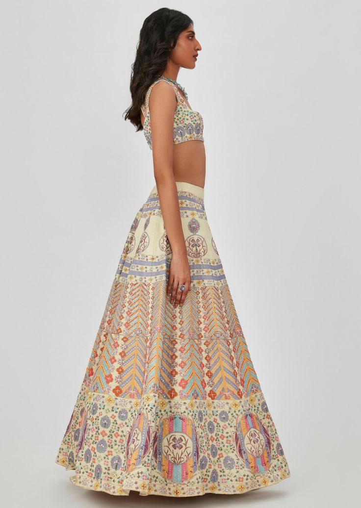 Beige kasab satin multicolor printed lehenga and blouse with heavy embellishment. Multicolor Silk Sets With Resham Embroidery, Silk Lehenga With Printed Motifs In Traditional Drape, Silk Lehenga With Printed Motifs And Traditional Drape, Festive Silk Lehenga With Printed Motifs, Silk Lehenga With Printed Motifs For Festive Occasions, Floor-length Silk Sets With Printed Motifs, Bollywood Style Silk Sets With Digital Print, Anarkali Style Multicolor Art Silk Palazzo Set, Festive Unstitched Lehenga With Printed Motifs