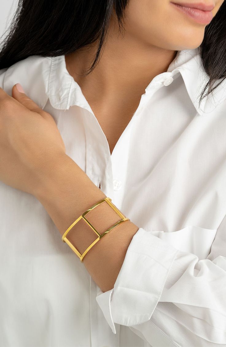 Keep your look classic with a polished bangle bracelet complete with 14-karat-gold plating. 2.5" width Water-resistant 14k-gold plate stainless steel
 Imported Modern Gold-tone Gold Plated Cuff Bracelet, Modern Gold Cuff Jewelry, Modern Gold Cuff Bracelet With Jubilee Design, Adjustable Gold-tone Classic Cuff Bracelet, Classic Adjustable Gold-tone Cuff Bracelet, Gold-tone Tarnish Resistant Cuff Bangle, Tarnish Resistant Gold-tone Bangle Cuff Bracelet, Tarnish Resistant Gold-tone Cuff Bangle, Classic Gold-tone Metal Cuff Bracelet