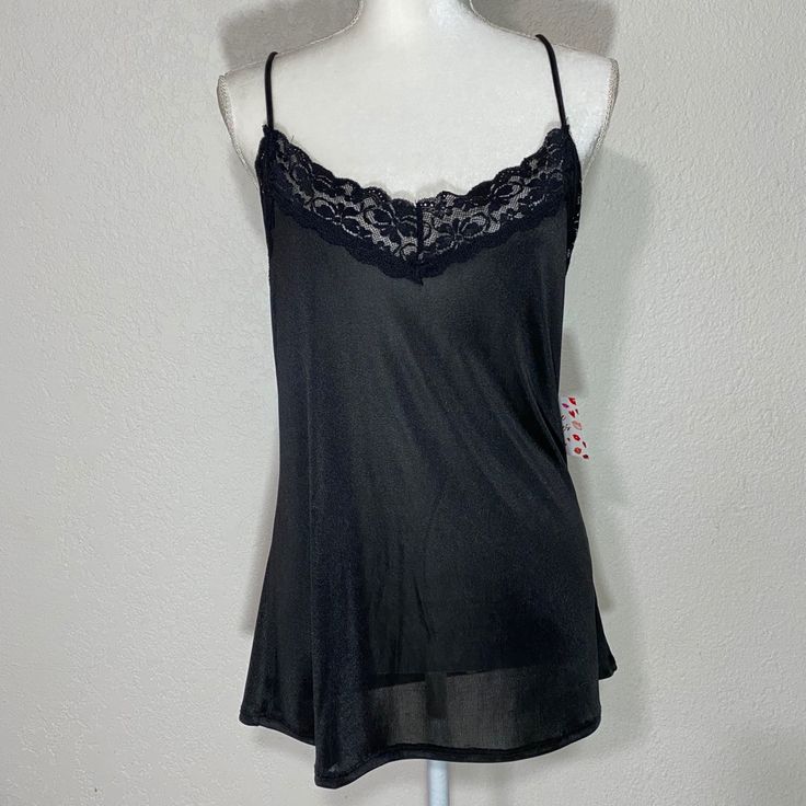 Free Kisses Black Camisole Tank Blouse Size: Large Color: Black Approximate Measurements Pit To Pit: 20in Length: 24in New With Tag Black Tank Top With Built-in Bra For Loungewear, Black Cami Top With Built-in Bra, Black Camisole With Built-in Bra For Loungewear, Black Stretch Camisole For Night Out, Stretch Black Camisole For Night Out, Flirty Cami Lace Top, Black Sleeveless Camisole With Built-in Bra, Sheer Stretch Camisole Top, Flirty Lace Cami Top