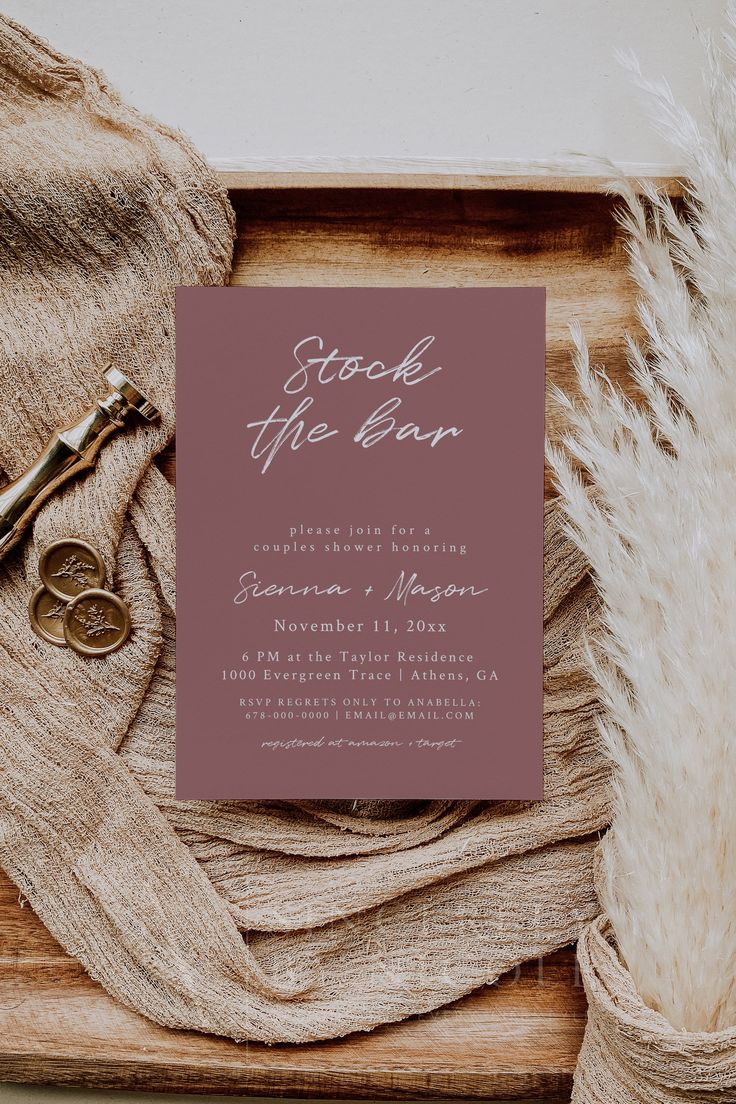 a wedding save the date card on top of a table with some scissors and other items