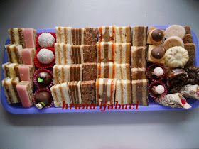 a blue tray filled with lots of different types of desserts