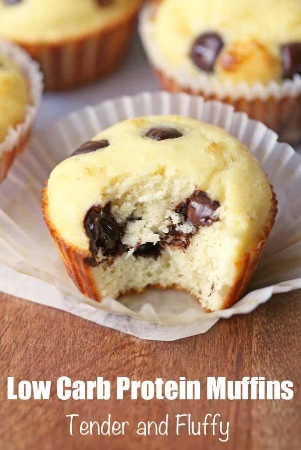 chocolate chip muffins in paper cups on a wooden table