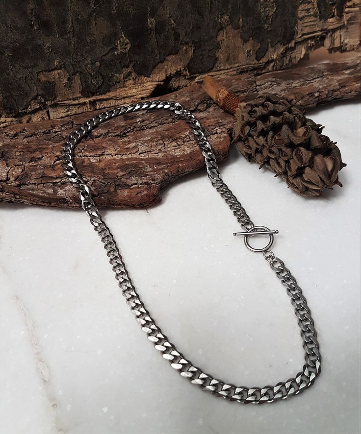 "Womens dark silver stainless steel cuban link chain necklace, sturdy curb chain necklace, unisex hipster style chain necklace, women's gift Welcome to my shop! ✈️ DHL EXPRESS SHIPPING AVAILABLE, 1-3 BUSINESS DAYS DELIVERY! ✔️ PLEASE MAKE SURE TO SELECT IT, RIGHT BEFORE YOUR PURCHASE! ❗️ ❗️ DON'T FORGET TO ADD YOUR CELL # AT THE \"NOTE TO SELLER\" SECTION IF YOU CHOOSE DHL! BY FILLING YOUR CELL NUMBER YOU EARN THE BENEFIT TO CHOOSE BETWEEN 6 DIFFERENT DELIVERY OPTIONS! INSTRUCTIONS WILL BE SENT Trendy Silver Cuban Link Necklaces, Trendy Silver Cuban Link Jewelry, Trendy Silver Cuban Link Necklace, Minimalist Silver Cuban Link Jewelry, Trendy Cuban Link Silver Chain Necklace, Trendy Cuban Link Necklace With Silver Chain, Minimalist Cuban Link Chain Jewelry, Trendy Silver Curb Chain Necklace, Minimalist Chunky Chain Stainless Steel Necklace