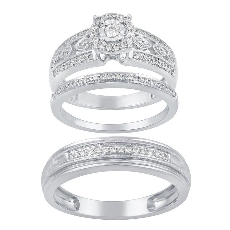 two white gold wedding rings with diamonds on each band and the center diamond in the middle