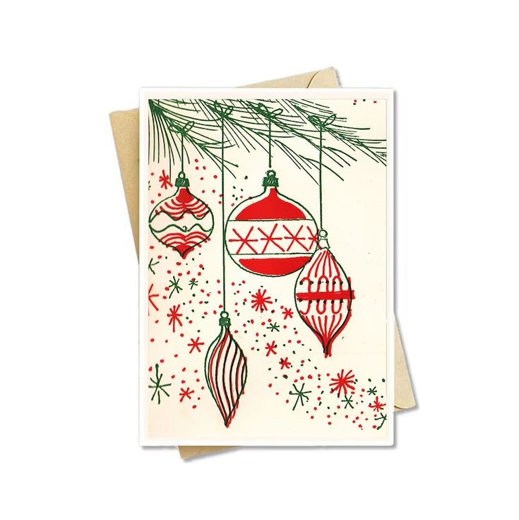 a christmas card with ornaments hanging from it