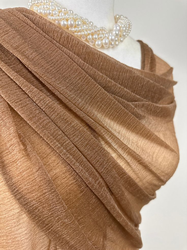 This fasionable versatile sheer chiffon shawl can be used to dress up an outfit for a special evening, a wedding or as a neck scarf. Effortlessly give a dress a new look by simply adding this shawl. Perfect as bridesmaid gifts or wedding favours, the perfect gift for any occasion. Mix and match with similar or contrast color jewelry, soaps, hand lotions or a box of chocolates and make the perfect personalized gift pack. Perfect as wedding coverup, bridesmaids gifts. Measures 20"Wx 74"L rectangul Elegant Gold Scarf For Evening, Elegant Beige Scarf Wrap, Elegant Beige Wrap Scarf, Sheer Shawl For Evening, Elegant Sheer Shawl For Parties, Elegant Shawl For Summer Parties, Elegant Sheer Dupatta Shawl, Elegant Beige Wedding Wraps, Elegant Summer Shawl Wrap