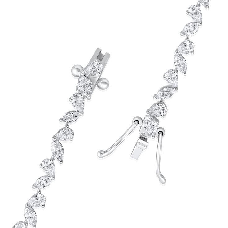 Crafted in 11.06 grams of 14K White Gold, the bracelet contains 54 stone of Pear and Marquise Lab Created Diamond with a total of 3.92 carat in E-F color and VVS-VS clarity. The bracelet length is 7 inches. Gift Marquise White Gold Diamond Bracelet, Gift Marquise Diamond Bracelet In White Gold, Luxury Marquise Cubic Zirconia Bracelets, White Gold Diamond Bracelet Marquise Shape Gift, Marquise Diamond Bracelet In White Gold As A Gift, White Gold Marquise Diamond Bracelet Gift, White Gold Marquise Bracelets With Diamond Accents, Marquise Diamond Cut Bracelets In Fine Jewelry, White Gold Marquise Cubic Zirconia Bracelet