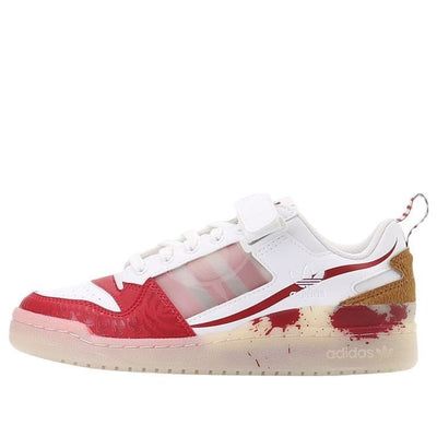 a white and red sneaker with paint splattered on the upper part of it