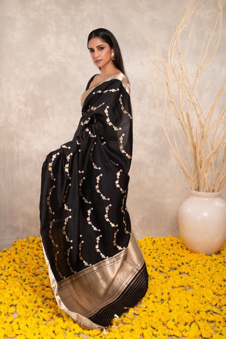 Expertly crafted with pure Katan silk, this black Banarasi saree features intricate Kaduwa sona rupa motifs. The traditional design and luxurious fabric make it a versatile addition to any wardrobe. Elevate your style with this exquisite and timeless piece. Black Art Silk Pre-draped Saree With Zari Weaving, Black Cotton Silk Pre-draped Saree For Diwali, Black Pre-draped Saree With Resham Embroidery, Bollywood Style Black Cotton Silk Pre-draped Saree, Elegant Black Pre-draped Saree With Zari Work, Black Bollywood Handloom Pre-draped Saree, Black Silk Handloom Pre-draped Saree, Black Pre-draped Saree With Zari Weaving For Puja, Traditional Black Pre-draped Saree