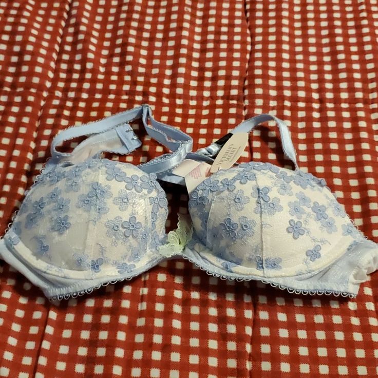 Victoria Secret Bra Elegant Light Blue Bra With Padded Cups, Elegant Light Blue Padded Bra, Fitted Lace Bra In Light Blue, Elegant Blue Bra For Spring, Elegant Blue Spring Bra, Elegant Light Blue Victoria's Secret Bra, Blue Lace Trim Bra For Spring, Victoria's Secret Spring Push-up Bra, Victoria's Secret Padded Bra For Spring