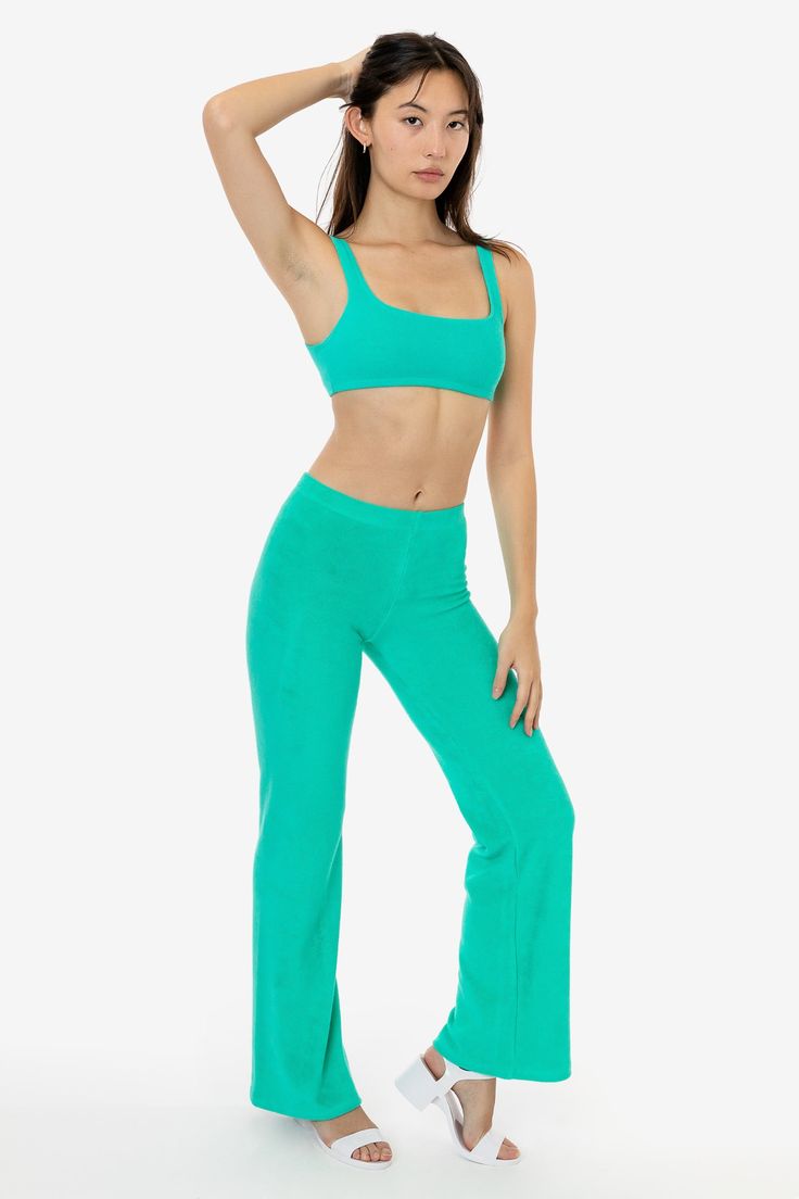 These versatile loop terry pants will elevate your loungewear or make the perfect layering piece after the beach. They feature a low to mid-rise fit and flared leg for a dressier look when desired. Pair with one of our bodysuits or matching loop terry tops for a fun dinner outfit or one of our matching baby tees for a more casual approach. Our loop terry has a subtle, natural stretch and a stretchy elastic waistband make for a comfortable fit for any occasion. This garment is intended to sit jus Casual Flare Yoga Pants For Loungewear, Solid Flare Yoga Pants For Loungewear, Sporty Flare Pants For Loungewear, Sporty Flare Lounge Pants, Summer Stretch Sweatpants For Lounging, Summer Full-length Sweatpants For Loungewear, Wider Hips, Fun Dinner, Dinner Outfit