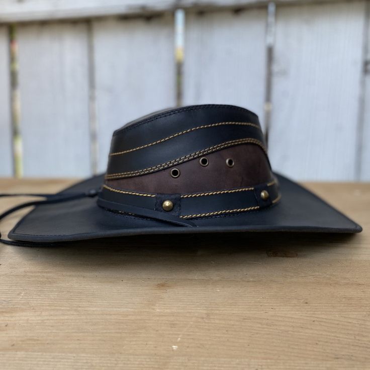 The price INCLUDES sales taxes and SHIPPING costs within the United States
This authentic leather hat, with its distinctive design and a star on the hat band, is a must-have accessory for a unique style. With a 3" brim and 4" crown, this black hat includes an adjustable drawstring for the perfect fit. Made 100% in Mexico, it is ideal for those looking for a quality leather hat with a touch of distinctive character.
Description of the Hat:
Because this hat is made of 100% genuine leather, the col Leather Fedora With Curved Brim For Country Events, Adjustable Leather Fedora, Vintage Leather Fedora For Rodeo, Adjustable Vintage Leather Hat, Luxury High Crown Adjustable Hat Bands, Brown Leather Hat Band With Sweatband, Adjustable Leather Fedora With Short Brim, Vintage Leather Hat Band For Rodeo, Leather Brimmed Fedora For Country Events