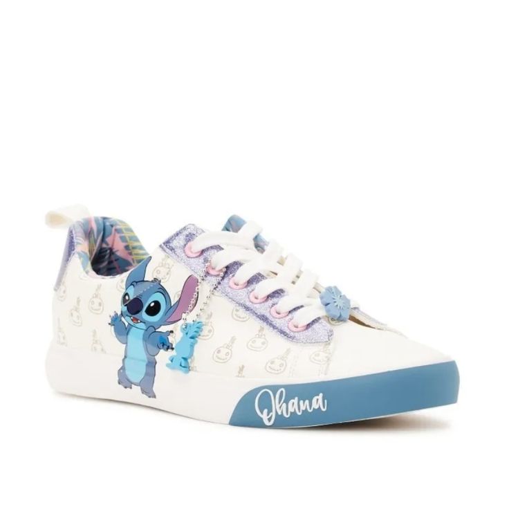 These Cute Sneakers Include Fan Favorite, Stitch, Blue Glitter And A Tropical Inner Print To Add A Pop Of Color To Your Outfit. Includes A Removable Keychain With The Silhouette Of Lilo's Doll Scrump To Match The Allover Scrump Print On The Sides. Bonus: An Adorable Hibiscus Flower Lace Charm Sits At The Front For Extra Flair. Shoe Closure: Lace-Up Materials: Manmade Upper End Use: Casual Silhouette For Everyday Wear Clean & Care: Wipe Clean With Damp Cloth Features: Fun Prints; Blue Glitter Det Synthetic Sneakers With Character Print And Round Toe, Disney Low-top Sneakers With Rubber Sole, Disney Character Print Sneakers With Round Toe, Cute Low-top Synthetic Sneakers, Blue Lace-up Synthetic Canvas Shoes, Casual Low-top Sneakers With Character Print, Cute Lace-up Sneakers With Speckled Midsole, Cute Slip-on Synthetic Sneakers, Cute Low-top Sneakers With Vulcanized Sole