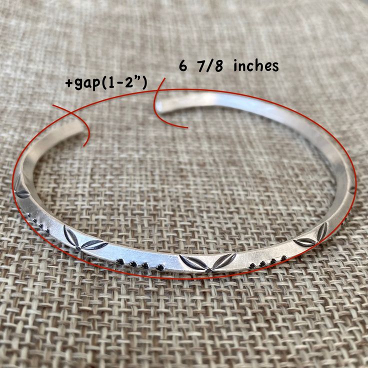 "Handmade Sterling Silver adjustable Cuff Bracelet with oxidized Engraving, Angular shape Bangle, Adjustable, for Woman or Man Measurements: Size: Adjustable, M-L for women, S-M for men Length: about 7\" / 17.5cm Width: 0.16\" / 4mm Weight: 0.43oz / 12gr Metal Purity: 95% Silver (higher than sterling Silver - 92.5%) To browse some more of our Silver Jewelry collection you can click on the following links: https://www.etsy.com/shop/SilverShapes Earrings: https://www.etsy.com/shop/SilverShapes?sec Unique Adjustable Bracelet With Oxidized Finish, Adjustable Stamped Sterling Silver Bangle, Adjustable Artisan Stamped Bangle, Artisan Adjustable Stamped Bangle, Unique Adjustable Oxidized Cuff Bracelet, Adjustable Etched Round Cuff Bracelet, Artisan Adjustable Bangle With Oxidized Finish, Adjustable Etched Cuff Bracelet, Adjustable Oxidized Cuff Jewelry