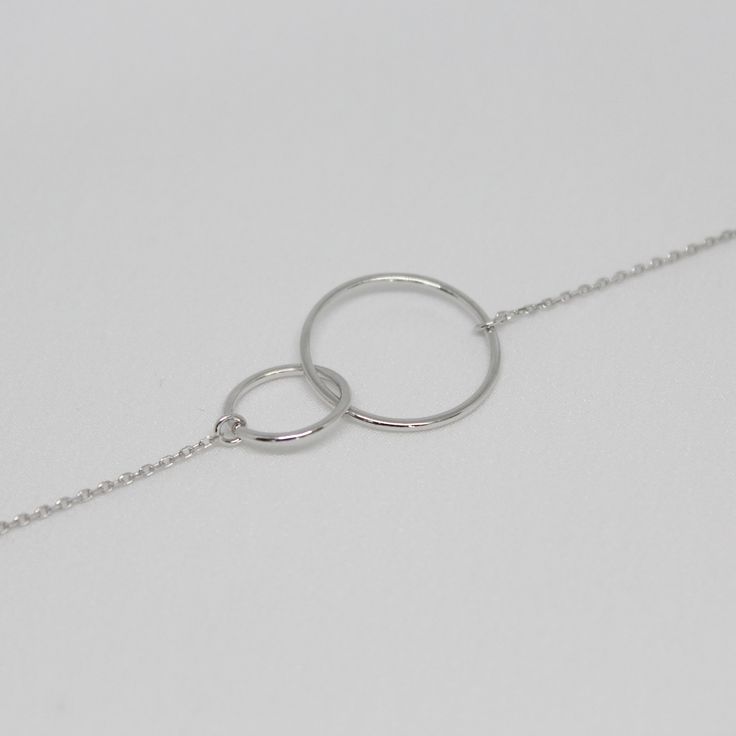 Dimensions Larger circle diameter - 17mm Smaller circle diameter - 13mm Necklace Length: 40 + 5cm (15.7 + 1.9inch) 45 + 5cm (17.7 + 1.9inch) 50 + 5cm (19.6 + 1.9inch) Silver necklace with intertwined circles. The elegant chain style will perfectly accentuate your neck and collarbone. With a simple yet luxurious design, this pendant can easily complement any look, giving it completeness and accent. Materials and designs give a special shine to this piece that will beautify you. As a present Jewel Hypoallergenic White Gold Circular Jewelry, Hypoallergenic Circular White Gold Jewelry, Adjustable Open Circle Metal Jewelry, Modern Adjustable Infinity Jewelry, Nickel-free Adjustable Full Circle Jewelry, Hypoallergenic Round Stainless Steel Jewelry, Infinity Shaped Metal Jewelry With Adjustable Chain, Metal Infinity Jewelry With Adjustable Chain, Infinity Metal Jewelry With Adjustable Chain