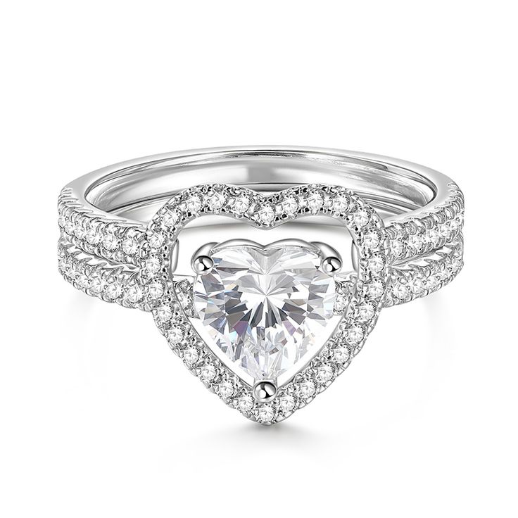 a heart shaped diamond ring with two rows of diamonds on the band and an open halo style