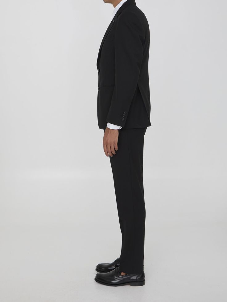 Two-piece suit in black virgin wool. Single-breasted jacket with classiclapels, brooch on lapel, front button closure, two front welt pockets, a welt pocket on chest and buttoned cuffs. Straight-leg trousers with zip, button and hook-and-eye closure, two side welt pockets and two rear buttoned welt pockets. Regular fit. Size nationality: ITComposition: 97% Virgin Wool, 3% Elastane Leather Cap, Single Breasted Jacket, Wool Suit, Straight Leg Trousers, Blazers For Men, Emilio Pucci, Designer Suits, Italian Fashion, Welt Pockets