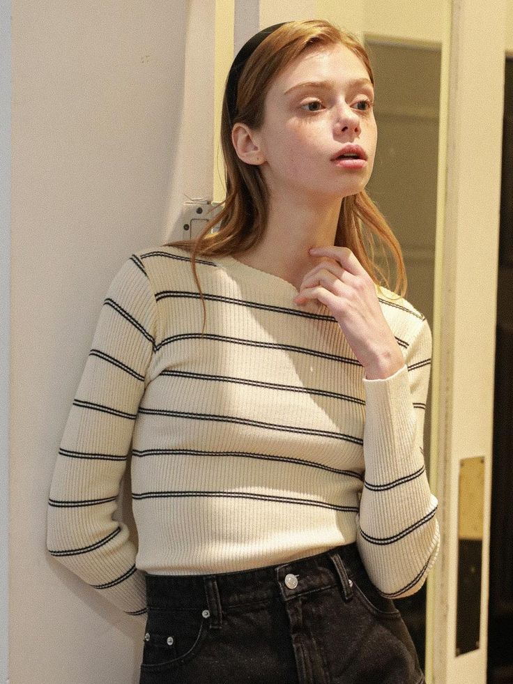 This product is a classic striped round knitwear, offering a timeless design that pairs well with a variety of bottoms. The ribbed texture and fitted silhouette provide a sleek appearance, making it a staple for both casual and smart-casual looks. It's an essential piece for anyone looking to add a sophisticated yet comfortable item to their wardrobe. - Striped design adds a bold, graphic element to the knitwear, allowing for easy styling with simple or layered outfits.- Ribbed texture not only contributes to the aesthetic but also ensures a snug and flexible fit.- Crafted with a blend of materials that offer durability and softness for everyday wear.- The round neckline complements various body types and adds a clean line to the neck area. Striped Knit Sweater For Work, Striped Sweater With Ribbed Cuffs For Work, Classic Striped Sweater With Ribbed Cuffs, Elegant Striped Sweater For Spring, Classic Striped Crew Neck Sweater, Classic Striped Knit Tops, Classic Striped Tops With Ribbed Cuffs, Classic Striped Knit Sweater, Striped Sweater For Work