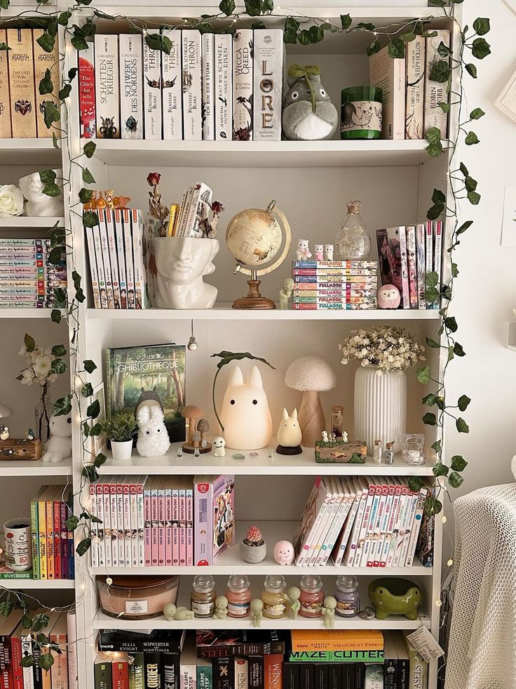 a bookshelf filled with lots of books next to a lamp and other items