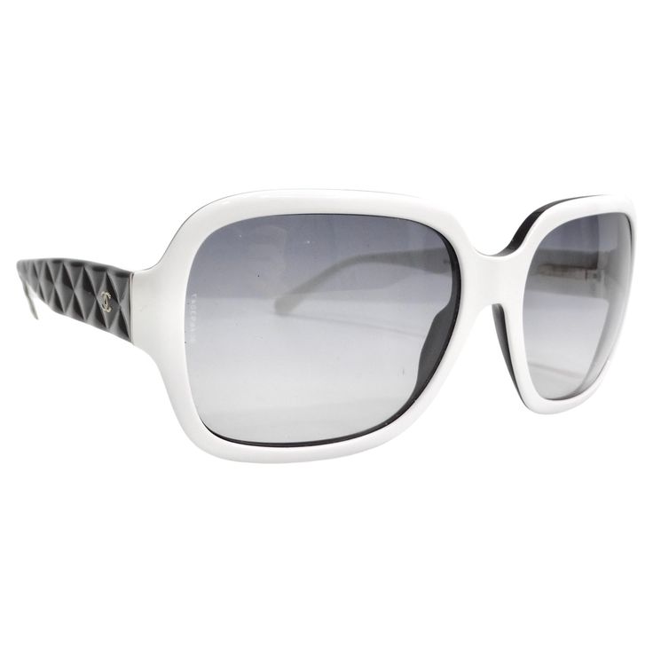 Introducing the Chanel Acetate Quilted CC Sunglasses, a stunning addition to your eyewear collection. This sophisticated pair features a striking white and black frame with large squared rims and grey-tinted lenses, offering a bold and fashionable look that seamlessly balances style and functionality. The unique design is elevated by the black faux quilted arms, reminiscent of Chanel's iconic quilted pattern, adding texture and depth to the overall aesthetic. A small gold tone Chanel CC logo sub Fendi Heels, Christian Dior Handbags, Quilted Pattern, Dior Handbags, Cc Logo, Black Frame, Christian Dior, Sunglasses Accessories, Classic Design