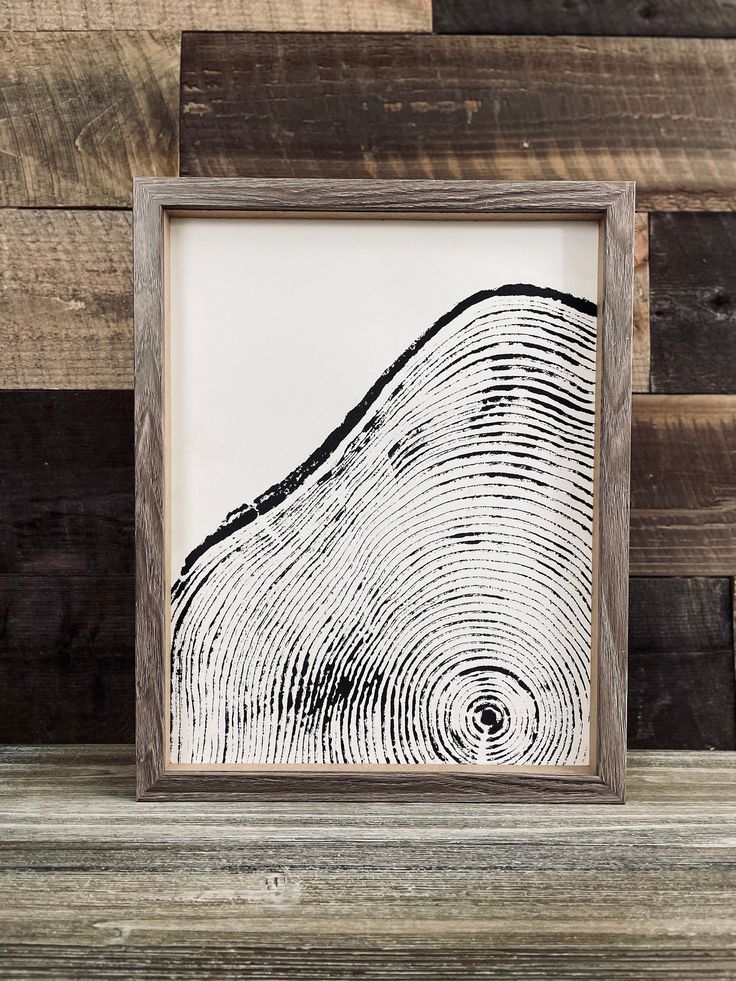 a wooden frame with a black and white wood grain pattern on the inside of it