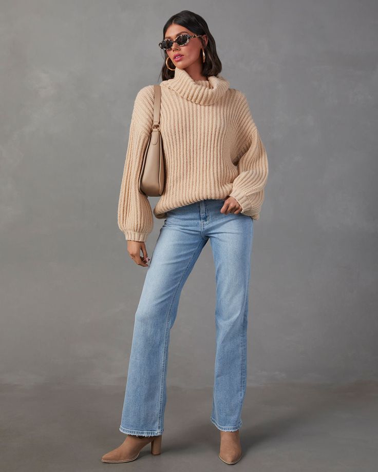 It's the season of oversized, cozy sweaters and the Milligan is a perfect choice! It has a loose turtle neckline, drop shoulders and is made from a lived-in knit fabric. Wear it 24/7 with your favorite jeans (no judgements here) or even as a sweater dress depending on your height! Oversized fit Turtle neckline Drop shoulders Knit fabric 100% Polyester Runs Large Trendy Oversized Knit Turtleneck, Trendy Fall Chunky Knit Turtleneck, Trendy Chunky Knit Turtleneck For Fall, Trendy Oversized Soft Knit Turtleneck, Slouchy Sweater With Ribbed Cuffs For Fall, Casual Chunky Knit Turtleneck For Fall, Oversized Soft Knit Casual Turtleneck, Soft Knit Turtleneck Sweater With Relaxed Fit, Relaxed Fit Soft Knit Turtleneck Sweater