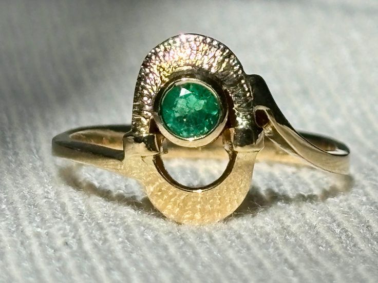 Size 6.5 Genuine Colombian emerald ring, 18K gold Approximately weight 3 grams Carats weight 0.2 carats - It's a very flattering minimalist Ring perfect for any occasion. -A good investment since 18k solid gold items hardly go down in value and in fact would go up in value long term. Packing Each order will be beautifully packaged for gift giving in a jewelry box. We only sell genuine natural emeralds directly from the Colombian mines of Chivor, Muzo, and Coscuez. The emerald mines of Chivor, Mu 14k Yellow Gold Emerald Ring With Tension Setting, 14k Gold Emerald Ring With Tension Setting, Formal Emerald Ring With Tension Setting For May Birthstone, Fine Jewelry Emerald Ring With Tension Setting, Yellow Gold 14k Emerald Ring With Tension Setting, Formal Emerald Rings With Tension Setting, Yellow Gold Emerald Ring With Tension Setting, Formal Yellow Gold Emerald Birthstone Ring, Hallmarked Yellow Gold Emerald Ring For May Birthstone