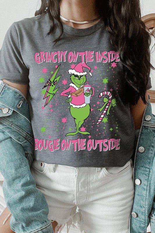 Embrace your inner 'Grinchy' side with a touch of 'Bougie' flair in this latest Christmas unisex short-sleeved tee. This playful graphic tee captures the holiday spirit with a twist, featuring a catchy slogan that reads 'Grinchy on the Inside, Bougie on the Outside.' Made from a comfortable blend of materials, this sweatshirt is both soft to the touch and durable for the winter season. Its unisex design ensures a great fit for everyone, making it a perfect gift or festive wardrobe staple. Proudl Short Sleeve Graphic T-shirt For Winter, Winter Graphic Print T-shirt With Short Sleeves, Winter Graphic Print Short Sleeve T-shirt, Relaxed Fit Short Sleeve T-shirt For Holiday, Christmas Graphic Print Short Sleeve T-shirt, Holiday Funny Print Short Sleeve Top, Funny Print Short Sleeve Holiday Top, Funny Short Sleeve Holiday Tops, Trendy Christmas T-shirt Crew Neck