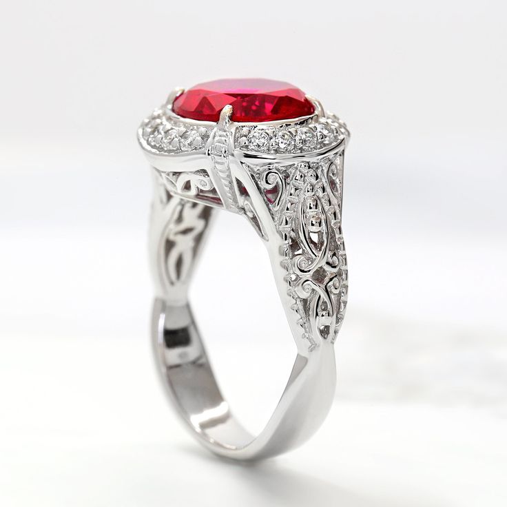 Women Sterling Silver Art Deco Design 2.5 carat Simulated Ruby Engagement Ring This beautiful Sterling Silver Art Deco Design 2.5ct Simulated Ruby Engagement Ring by DoubleAccent is meticulously crafted in gleaming and durable Sterling Silver. Our stones are the highest quality diamond simulants that are polished, finely cut, loupe clean, and have an exactly similar appearance and as beautiful as to naturally occurring diamonds. All cubic zirconia stone weights are approximate and listed as diam Red Diamond Ring With Brilliant Cushion Cut, Red Cushion Cut Brilliant Diamond Ring, Red Cushion Cut Diamond Ring With Brilliant Cut, Classic Red Sapphire Promise Ring, Gia Certified Fine Jewelry Red Ruby Ring, Red Brilliant Cut Cluster Ring For Promise, Red Brilliant Cut Birthstone Ring As Gift, Red Cluster Ring With Brilliant Cut For Promise, Red Brilliant Cut Birthstone Ring For Gift