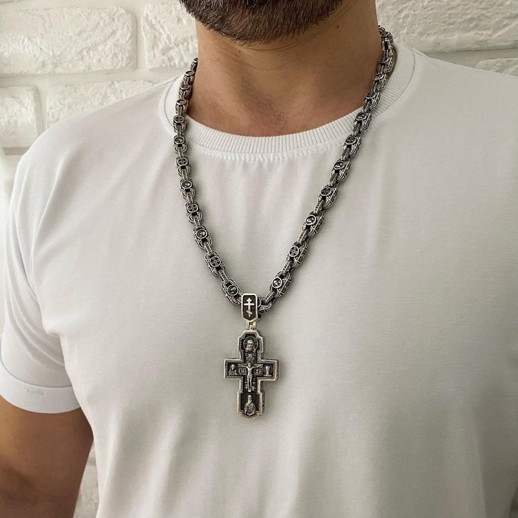 "Material: 925 Sterling Silver Weight: 150 gr. Width: 8/9mm Silver Orthodox cross. Silver 925 with blackening. Weight 57 grams (+ -) The size: 7 / 3.2 cm (with eyelet) 5 / 3.2 cm (excluding the lug) The cross depicts: Savior Not Made by Hands Crucifixion of jesus christ Kazan Icon of the Mother of God Nicholas the Wonderworker Sergius of Radonezh archangel Michael Prince Vladimir Archangel Gabriel George the Victorious At the end of the cross there is a prayer: \"Lord Jesus Christ, Son of God, H Gift Crucifix Cross Necklace With Chain, Gift Cross Necklace With Crucifix Chain, Spiritual Cross Necklace With Silver Chain For Gift, Sterling Silver Cross Chain Jewelry, Gift Jewelry Chain With Crucifix Shape, Symbolic Silver Cross Jewelry, Silver Symbolic Cross Necklace, Silver Cross Jewelry Symbolic Style, Silver Cross Jewelry With Symbolic Style