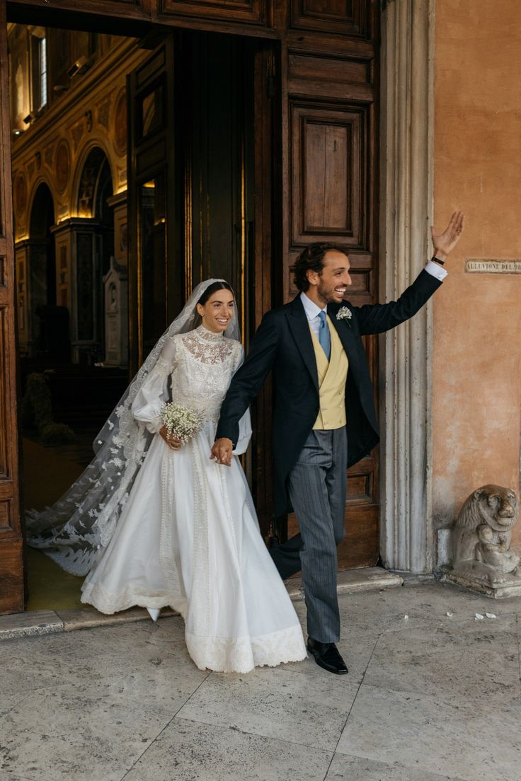 a bride and groom walking out of the church after their wedding ceremony at st mark's square in new york city