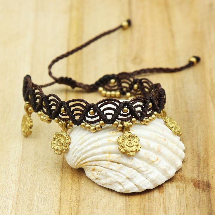 This fancy anklet is in dark brown macramé with small golden brass plates. Its size is adjustable on the ankle thanks to its sliding knot. This anklet can go in water because the brass does not move. You will wear this foot chain on an ethnic, boho or hippie chic outfit. foot chain width 2.5cm Gold Adjustable Friendship Bracelets For Festivals, Gold Friendship Bracelets With Sliding Knot For Festivals, Adjustable Gold Friendship Bracelets For Festivals, Adjustable Gold Friendship Bracelet For Festivals, Bohemian Gold Resizable Friendship Bracelets, Gold Bohemian Resizable Friendship Bracelets, Beach Jewelry With Brown Tassels, Handmade Bohemian Gold Anklets, Bohemian Gold Bracelet With Adjustable Cord