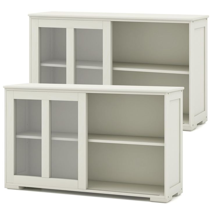 two white bookcases with glass doors on each side