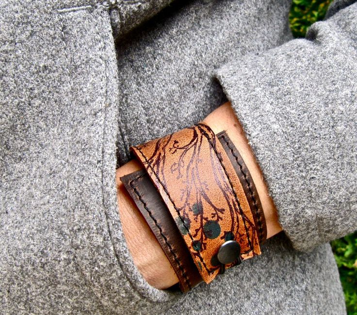 "I've made this wrapping cuff out of soft, scuffy brown and sienna brown leather. The leather has been hand printed with a design using indelible ink. Machine stitched, it has an attached elastic that hooks over a button, so this cuff will adjust to fit most wrist sizes 5.75\" to 7\" in circumference OR choose a custom size. At the narrowest, the width of the cuff is 1.25\" and at the widest it's 2\". Only premium quality leather and supplies are used to handcraft each item. Every item shipped i Wrap Armband, Leather Jewellery, Brown Leather Bracelet, Upcycled Leather, Multi Strand Bracelet, Leather Cuffs Bracelet, Leather Gifts, Leather Wrap Bracelet, Leather Cuffs