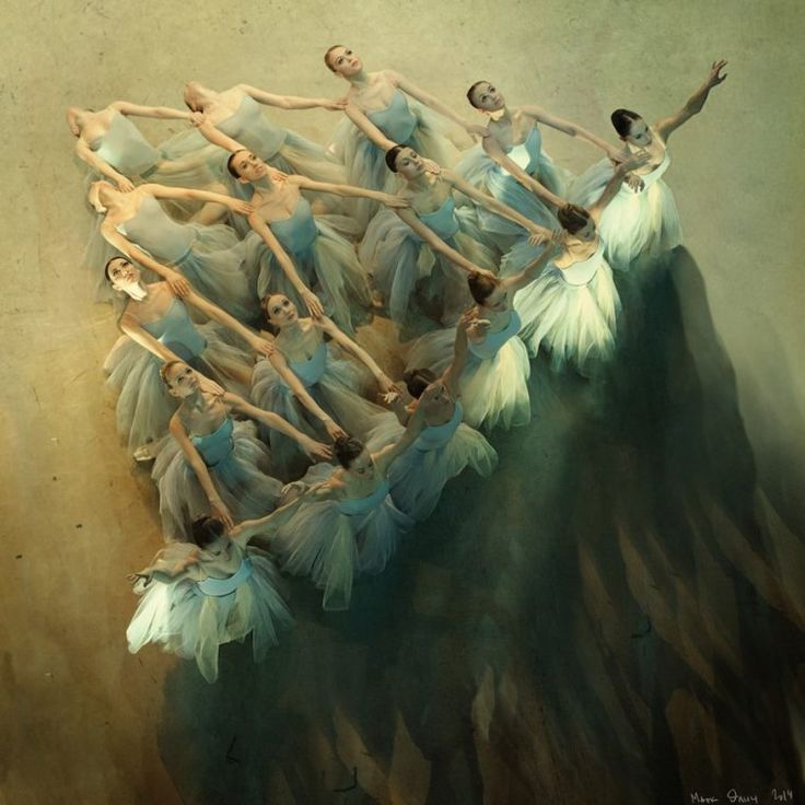 a group of ballet dancers in blue tutus and white feathers floating on top of each other