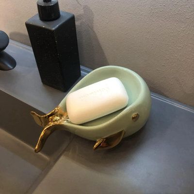 a soap dish sitting on top of a bathroom sink