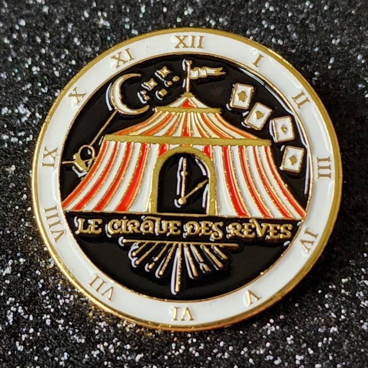 a close up of a badge on a black and white surface with the words le groupe des sevres