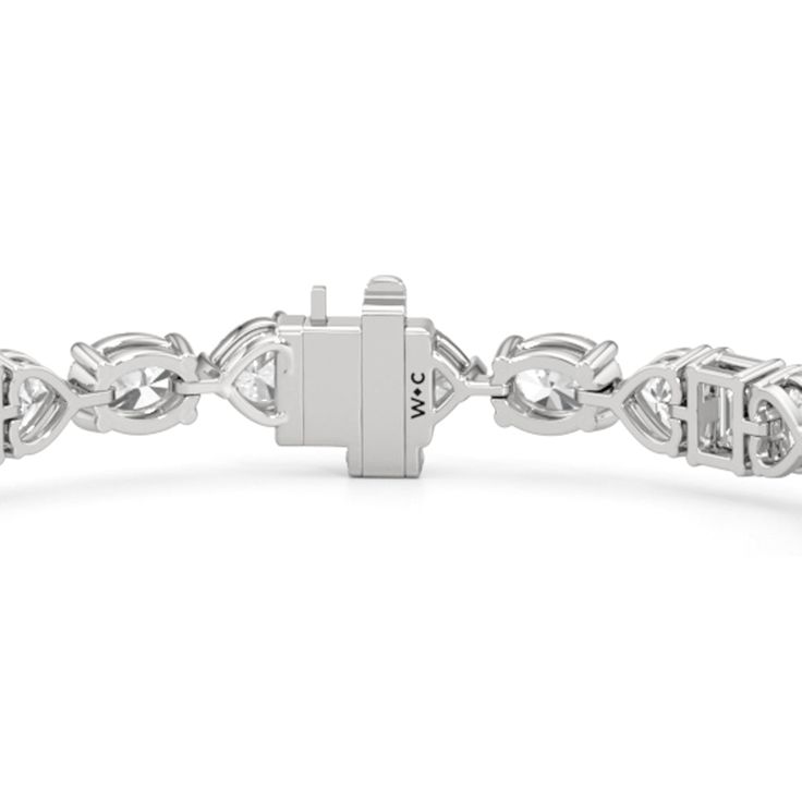 An exceptionally beautiful piece of jewelry infused with sentimentality. This tennis bracelet presents a dazzling pattern of oval, heart, and emerald-cut diamonds. It features emerald-cut diamonds set in between charming heart-shaped diamonds. Emerald-cut diamonds add a nostalgic flair to this piece. Fine Jewelry Heart Cut Diamond Bracelet, Heart Cut Diamond Bracelet In Fine Jewelry Style, Diamond Heart Cut Jubilee Bracelet, White Gold Heart Cut Tennis Bracelet For Formal Occasions, Elegant Diamond Heart Bracelet With Brilliant Cut, Classic Heart Cut Bracelet With Diamond Accents, Heart Cut White Gold Tennis Bracelet For Formal Occasions, Elegant Heart Cut Diamond Bracelet, Luxury Heart Cut Tennis Bracelet