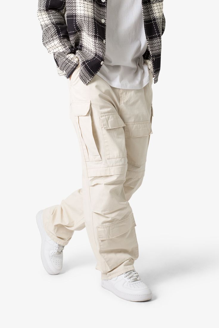 the Ultra Baggy Cargo Pants are designed with a new oversized ultra baggy fit, constructed from a ripstop fabric with a rinse wash, featuring cargo pockets throughout with snap closures, and finished with a button placket. details ultra baggy fit throughout 100% cotton extended inseam model is 6’1, 140 lbs and wears a size 30 Mens White Cargo Pants Outfit, White Denim Men Outfits, Gender Neutral Streetwear, Mens Streetwear Pants, Best Fits For Men, Gen Z Streetwear, Men’s Cargo Pants Styles, Bold Mens Fashion, Cargo Baggy Pants Outfit