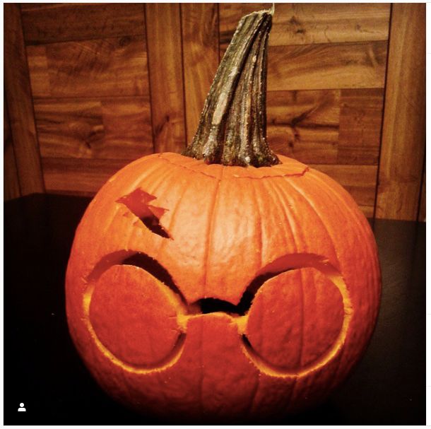 a pumpkin with glasses carved into it