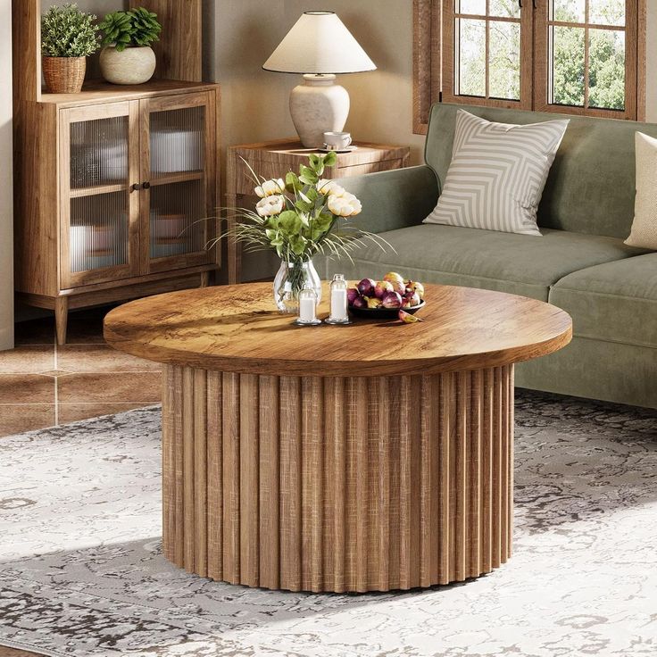 a living room filled with furniture and a large wooden table in front of a couch