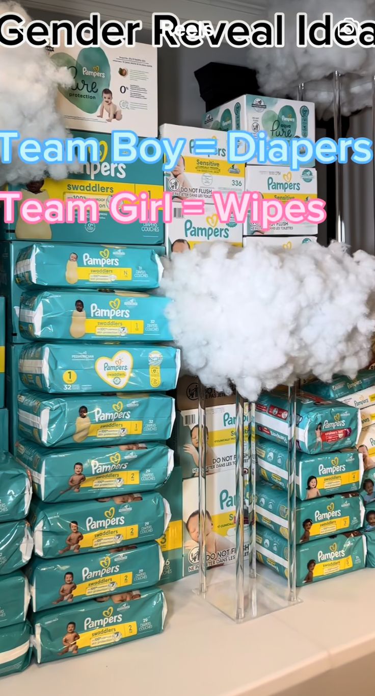 a pile of baby diapers sitting on top of a table next to boxes of wipes