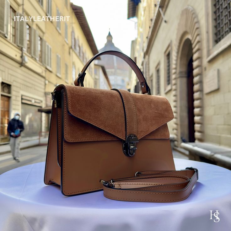 This bag has been made of the best genuine leather by local master crafters of Florence in Italy, designed for women who only accept premium Italian quality and luxury leather bags and modern Italian fashion. . Sizes: Width: 29cm/10.6 inch Height: 19cm/7.4 inch Depth: 7 cm/3.9 inch The story of this bag:  John was visiting Florence with his family and he wanted to find the perfect gift for his wife and daughters. He had heard about the exquisite leather craftsmanship in the city and was determin Everyday Luxury Brown Flap Bag, Modern Brown Flap Bag With Top Handle, Luxury Brown Bags For Daily Use, Luxury Brown Flap Bag For Everyday Use, Luxury Leather Satchel In Camel, Luxury Leather Camel Satchel, Camel Leather Top Handle Satchel, Luxury Camel Top Handle Satchel, Luxury Camel Leather Satchel