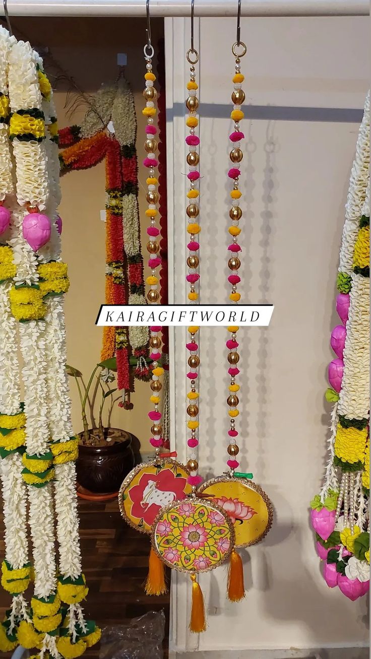 colorful garlands are hanging from the ceiling in front of a door with a sign that says, kajapagitworld