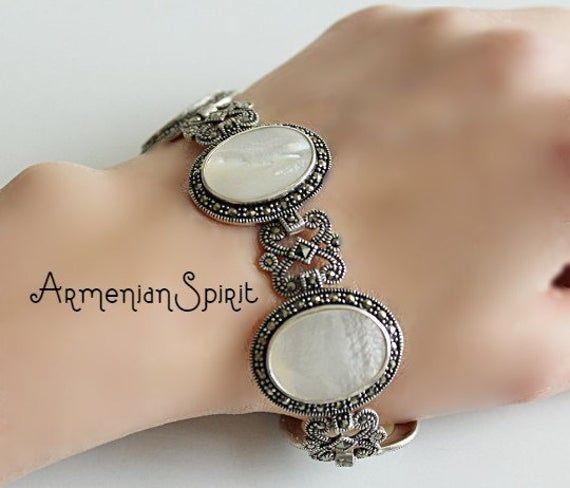 Vintage bracelet antique wedding jewelry Art deco Natural sadaf white silver ancient Mid century large bracelet old victorian MarcasiteFREE shipping Worldwide (tracked)Length: 8 inch = 20.3 cmWeight: 18 gramsShipping time:Europe 3 weeks.USA and other countries 3 weeksI don`t accept returns and exchanges.Request a cancellation within: 1 hour of purchase.FREE shipping Worldwide! Elegant Oval Jewelry With Historical Design, Antique White Bracelet Jewelry, White Antique Bracelet Jewelry, Traditional Oval Jewelry With Historical Design, White Antique Bracelet, Vintage Jewelry With Historical Design, Vintage Handmade Wedding Bracelets, Handmade Vintage Wedding Bracelets, Antique Gemstone Bracelet For Anniversary