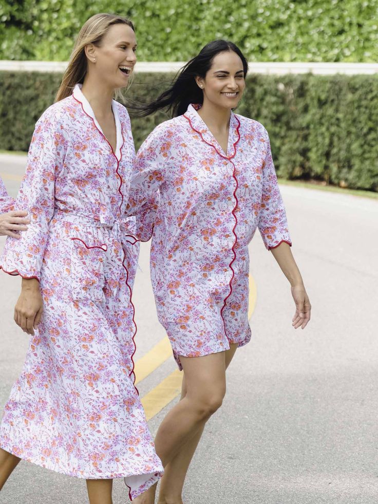 Getting dressed for bed is a stylish affair when you wear our pink floral nightshirt. Designed by Heidi and crafted in a custom floral pattern of pink watercolor botanicals, the nightshirt features three-quarter sleeves finished with a scalloped hem. Lightweight cotton offers the perfect level of warmth and comfort morning and night. ﻿This style is running small, please size up if needed Product Details Breathable, lightweight, and soft A slight A-line hem is a perfect length Painterly flower petals in pink are layered over a blue floral pattern for a chic contrast Red scalloped detail on the collar and cuffs adds a refined and finished touch 3/4-sleeve length Spacious side pockets to hold your phone and other necessities Button closures lay flat and keep the nightshirt closed 100% Cotton Watercolor Botanicals, Ski Print, Blue Floral Pattern, Glamour Shots, Getting Dressed, Blue Hydrangea, Pink Watercolor, Night Shirt, Scalloped Hem