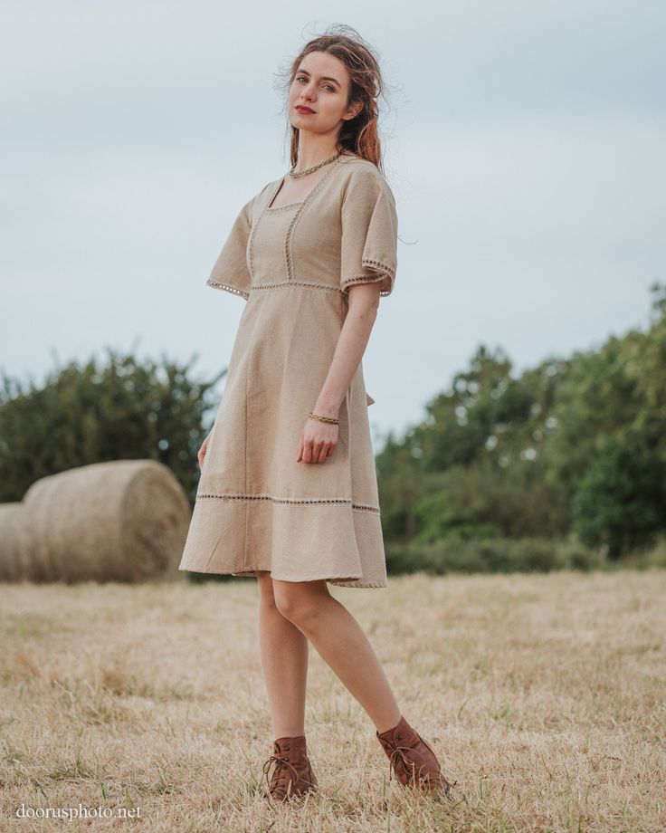 Harvest Dress We are currently waiting the arrival of a new production of this dress. Orders will be shipped after July 11th. This folk inspired dress is constructed of 100% cotton jute which has a beautiful traditional weave. The fabric is similar to linen and has a crisp solid feel. This dress is not dyed and the colours seen are the natural colours of the plant spun in to thread. Super comfortable to wear, perfect for summer days. It also makes a great layer over leggings for cooler days. Sma Brown Cottagecore Dress For Summer, Beige Cottagecore Prairie Dress For Garden Party, Cottagecore Linen Dress For Garden Party, Spring Bohemian Beige Linen Dress, Spring Beige Bohemian Linen Dress, Spring Beige Linen Bohemian Dress, Beige Flax Summer Dresses, Spring Peasant Linen Dress, Spring Linen Peasant Dress