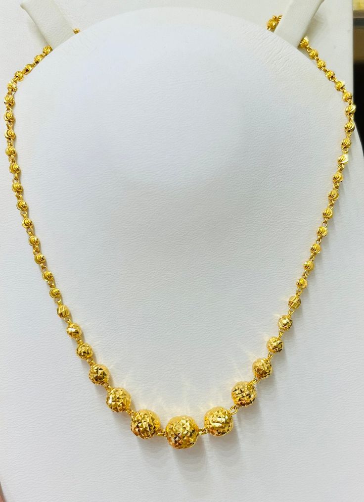 "Shining Laser beads beady long necklace 916 Yellow Gold Purity : 916 GOLD purity  Weight : 15 grams Appx Length: 24\" inches length Colour : yellow GOLD Hallmark : Hallmarked 916 (916 Stamp) Hook :  lobster hook  Design : Beautiful and shining laser beads necklace . 100% Authentic 916 gold guaranteed.  FAQs Q: Is it real gold? A: yes it's real authentic genuine 916 gold  Q: can pawn? A: yes it's pawnable ⭐️go for genuine gold⭐️" Gold Plated Round Bead Necklaces For Festivals, Gold Plated Beaded Necklaces For Festivals, Gold Plated Round Beads Necklace For Festivals, Gold Long Necklace With Round Beads For Gift, Gold Chain Necklace With Round Beads For Wedding, Gold Round Beads Chain Necklace For Wedding, Gold Long Necklace For Festivals, Yellow Gold Beaded Necklaces For Wedding With Polished Beads, Gold Faceted Bead Necklaces For Weddings