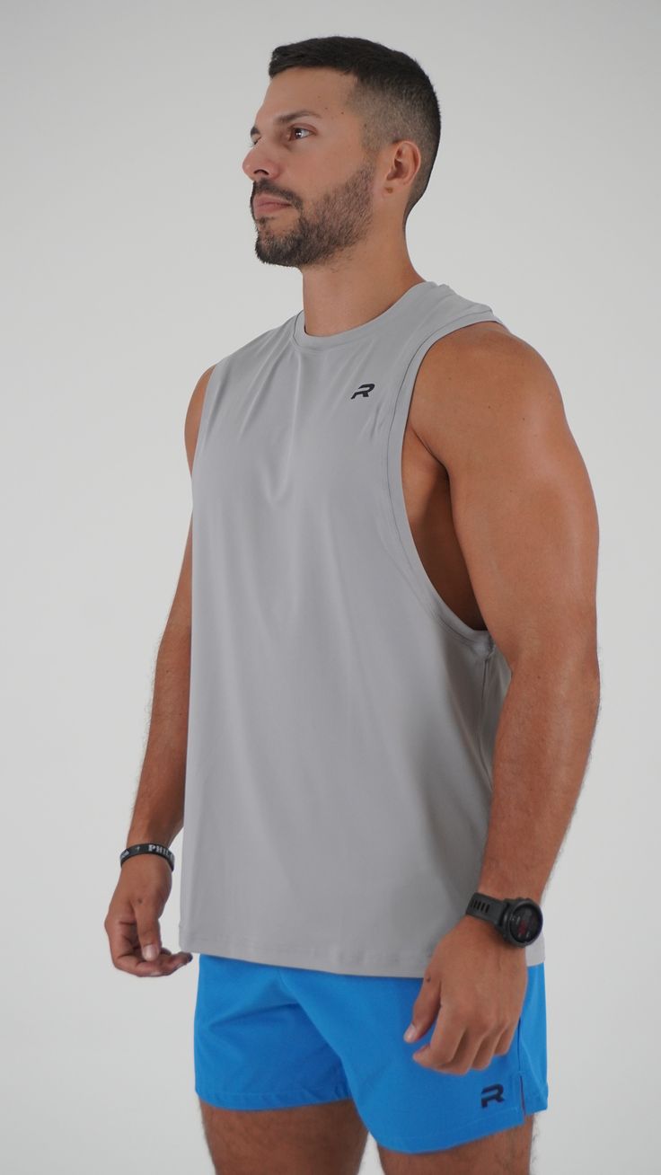 Experience ultimate performance and style with our Perform Cutout Tank Top! Made from breathable, stretchy fabric, this tank top ensures maximum comfort and mobility during your workout. The trendy cutout design adds a touch of style while helping you achieve your maximum potential. Elevate your workout wardrobe today! Racerback Tank Top With 4-way Stretch For Gym, Stretch Sleeveless Muscle Tee For Workout, 4-way Stretch Racerback Tank Top For Gym, Solid Color Tank Muscle Tee For Gym, Tank Muscle Tee For Gym, Gray Sports Tank Top, Gray Racerback Activewear For Gym, Sweat Resistant Racerback Tank Top For Gym, Gray Stretch Tank Top For Gym